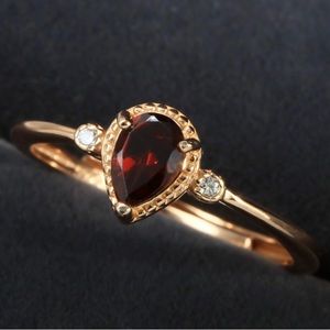 1 1/2 Ct Garnet and Created white Sapphire ring